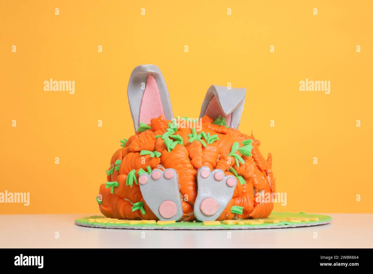 Carrot covered Easter bunny cake, happy Easter concept Stock Photo