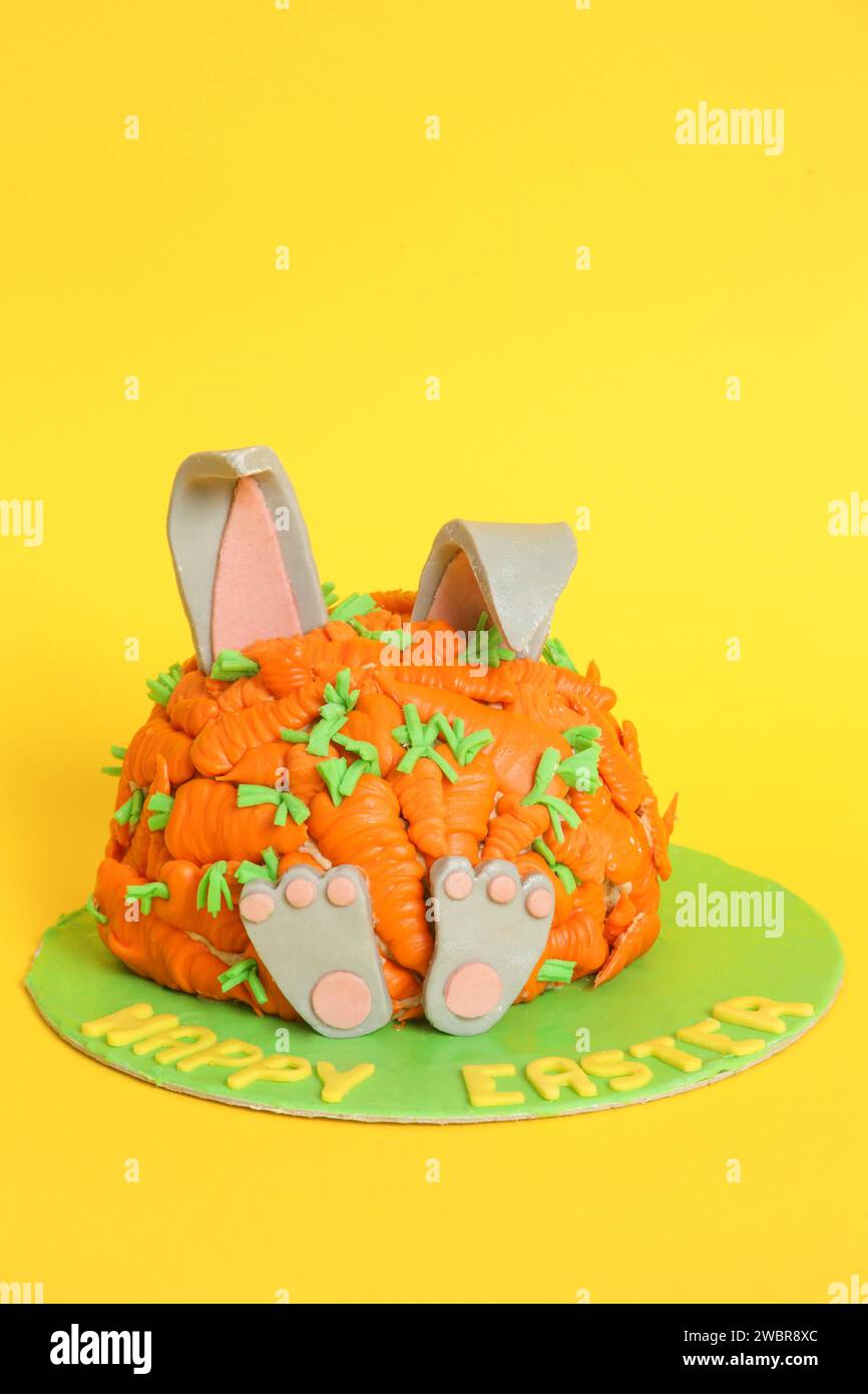 Carrot covered Easter bunny cake, happy Easter concept Stock Photo