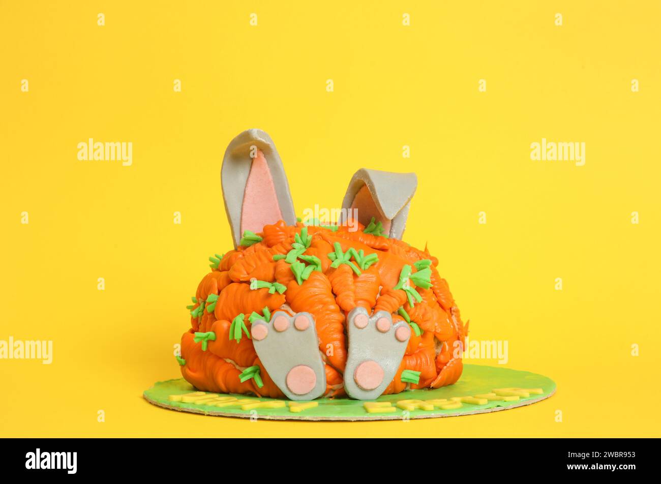 Carrot covered Easter bunny cake, happy Easter concept Stock Photo