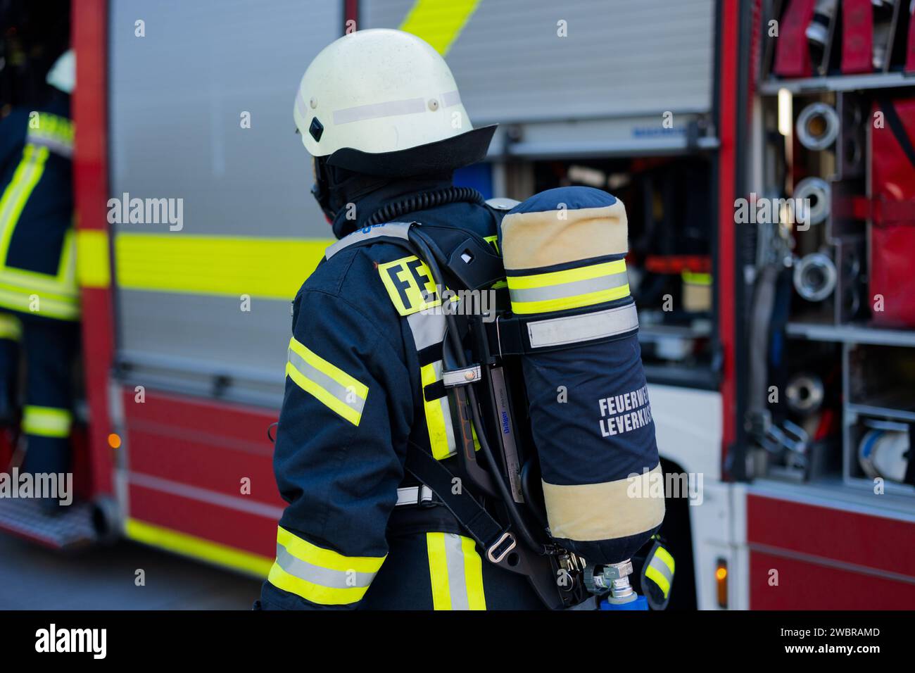 Leverkusen, Germany. 11th Jan, 2024. A firefighter in breathing ...