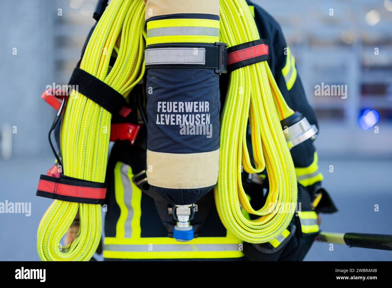 Leverkusen, Germany. 11th Jan, 2024. A firefighter in breathing ...