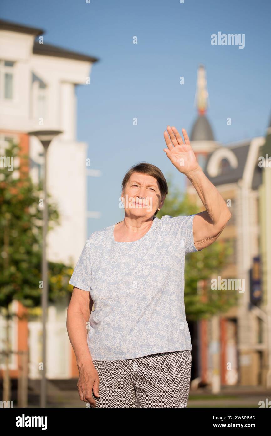Happy smiling old woman walks hi-res stock photography and images - Alamy