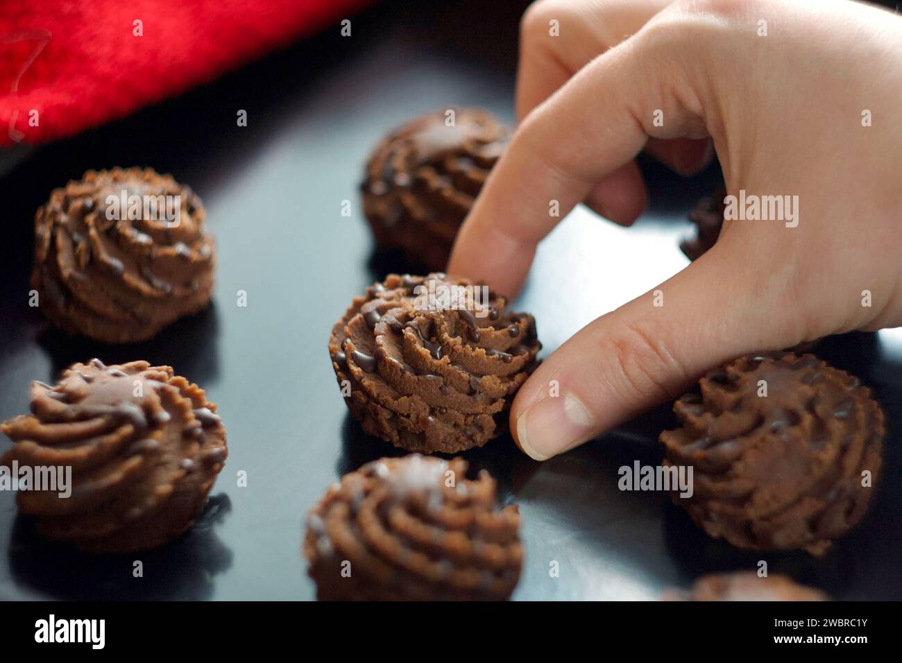 Chocolate brownie is on a baking sheet Stock Photo