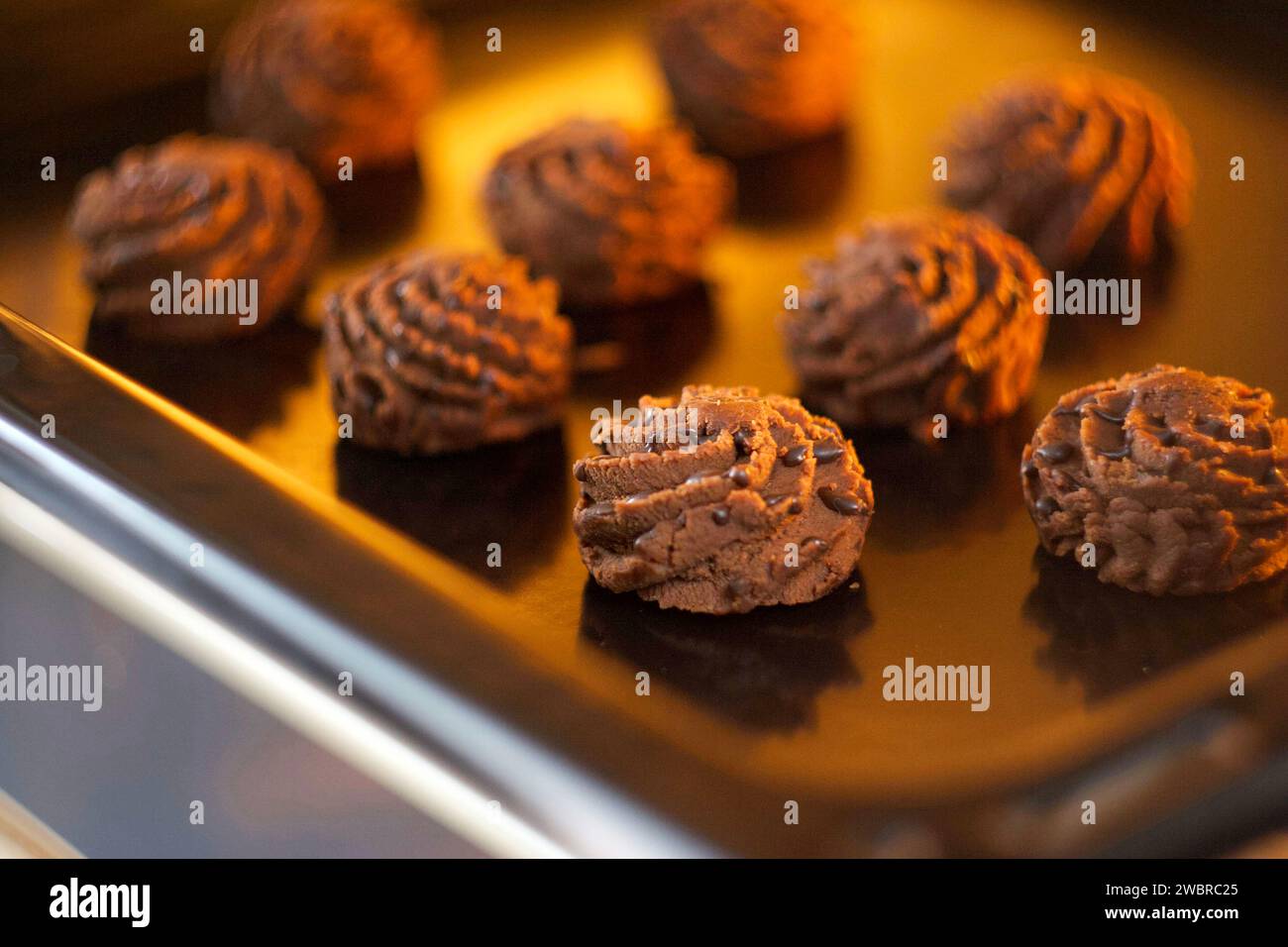 Chocolate brownie is on a baking sheet Stock Photo