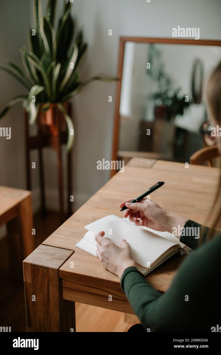 goal setting with a new notebook in January Stock Photo - Alamy