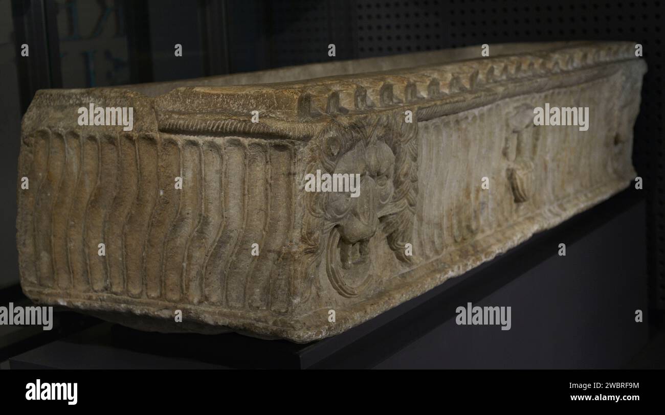 Sarcophagus of the Lions. Decorated with lion heads and strigils. Marble. 2nd century AD. External dimensions: 2.45 m. (length), 0.90 m. (width) and 0.55 m. (height). From Evora, Portugal. National Archaeology Museum. Lisbon, Portugal. Stock Photo