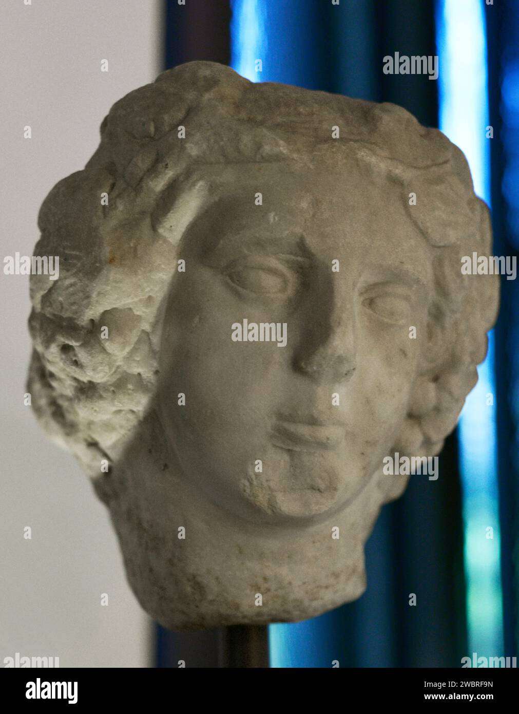 Dionysus (Bacchus). God of wine. Head of Dionysus. 1st and 2nd centuries AD. From Mértola, Beja district, Portugal. National Archaeology Museum. Lisbon, Portugal. Stock Photo