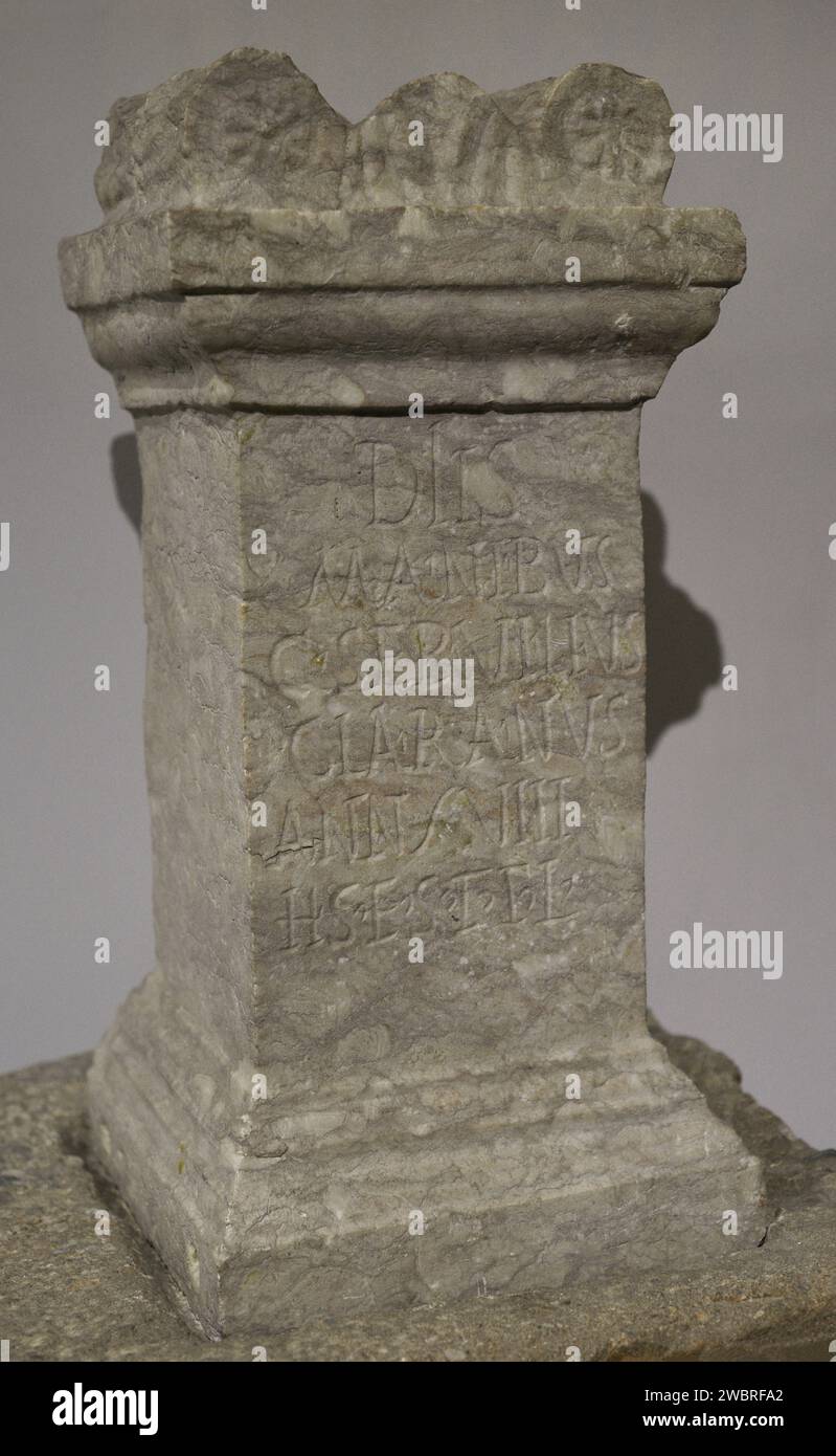 Funerary monument, shaped as a stone altar, and respective socle, of Caius Servilius Claranus. 2nd century AD. Inscription: 'Dedicated to Gods Manes. Caius Servilius Claranus, of 18 years, is buried here. May the earth be light on you!'. From the Roman ruins of Troia. Grândola, Setúbal district, Portugal. National Archaeology Museum. Lisbon, Portugal. Stock Photo