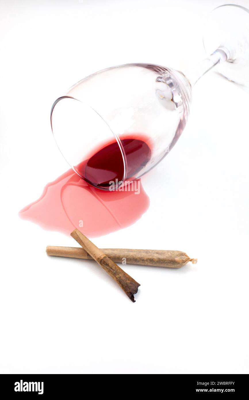 Marijuana joint with spilled red wine Stock Photo Alamy