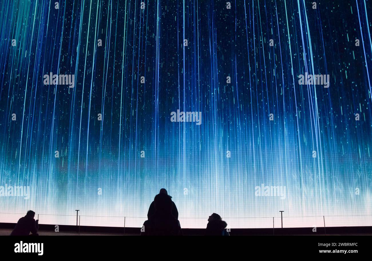 London, England, Uk. 12th Jan, 2024. Visitors watch Forsaken, a new short film displayed on the huge immersive screen at Outernet digital art venue in West End. The visual art piece, based around jellyfish swimming in the ocean, highlights mass species extinction. Forsaken was directed by Roland Lane and is supported by Greenpeace and Arts Council England. (Credit Image: © Vuk Valcic/ZUMA Press Wire) EDITORIAL USAGE ONLY! Not for Commercial USAGE! Stock Photo