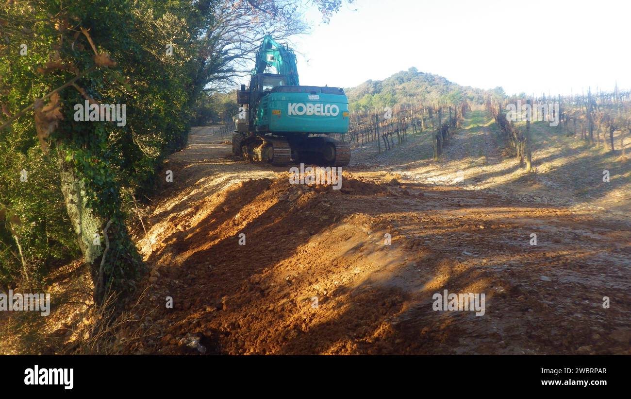 kobelco excavator at a construction site, heavy machinery for earthworks and building project kobelco Excavator at a construction site Stock Photo