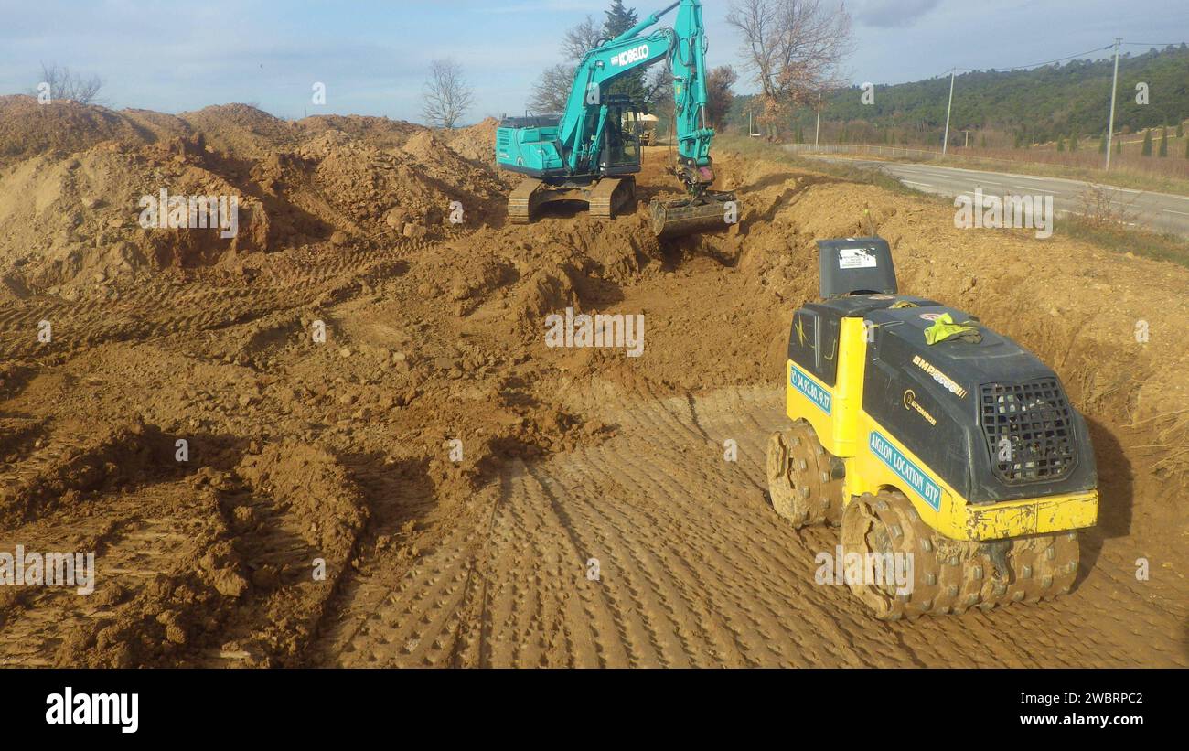 kobelco excavator at a construction site, heavy machinery for earthworks and building project kobelco Excavator at a construction site Stock Photo