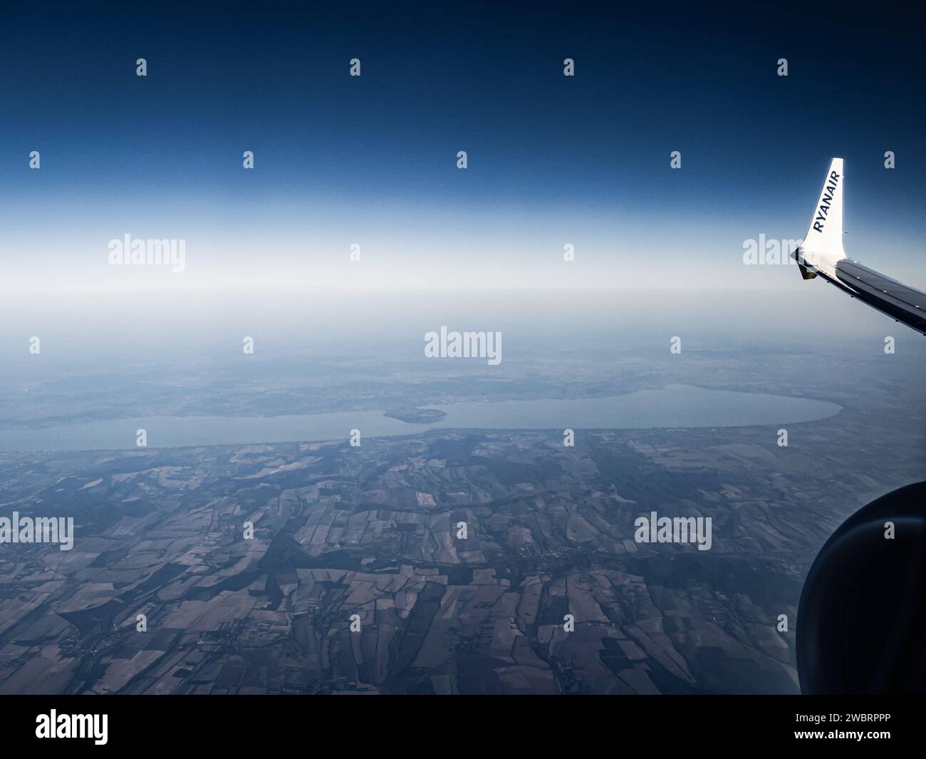 Lake Balaton in Hungary as seen from the window of a Ryanair airplane, economy airline, air travel, cheap flights Hungary Stock Photo