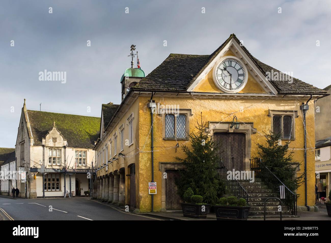 Grade 1 listed Market house and Sooty Fox Hotel in the centre of Tetbury, Gloucestershire, UK Stock Photo