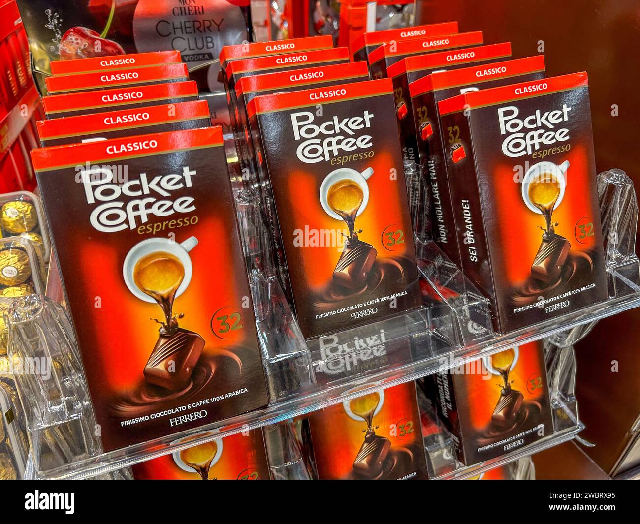 italy - January 12, 2024: Ferrero Pocket Coffee chocolates filled with coffee in packs on display for sale in Italian supermarket Stock Photo