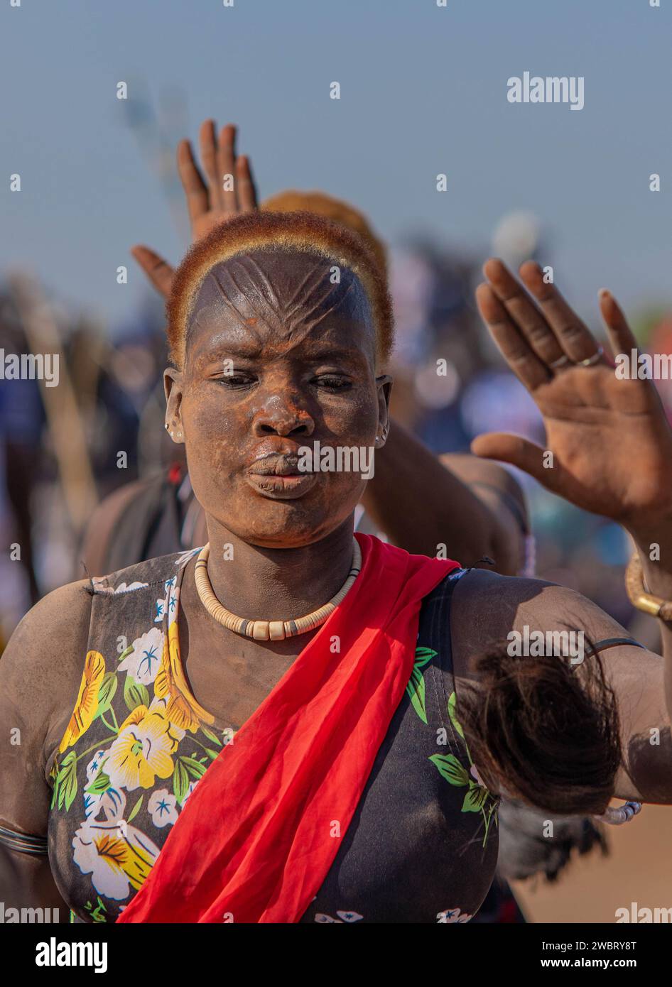 Adorned with traditional scarring, a Dinka woman radiates beauty and cultural pride during a captivating cultural gathering in Juba, South Sudan. Stock Photo