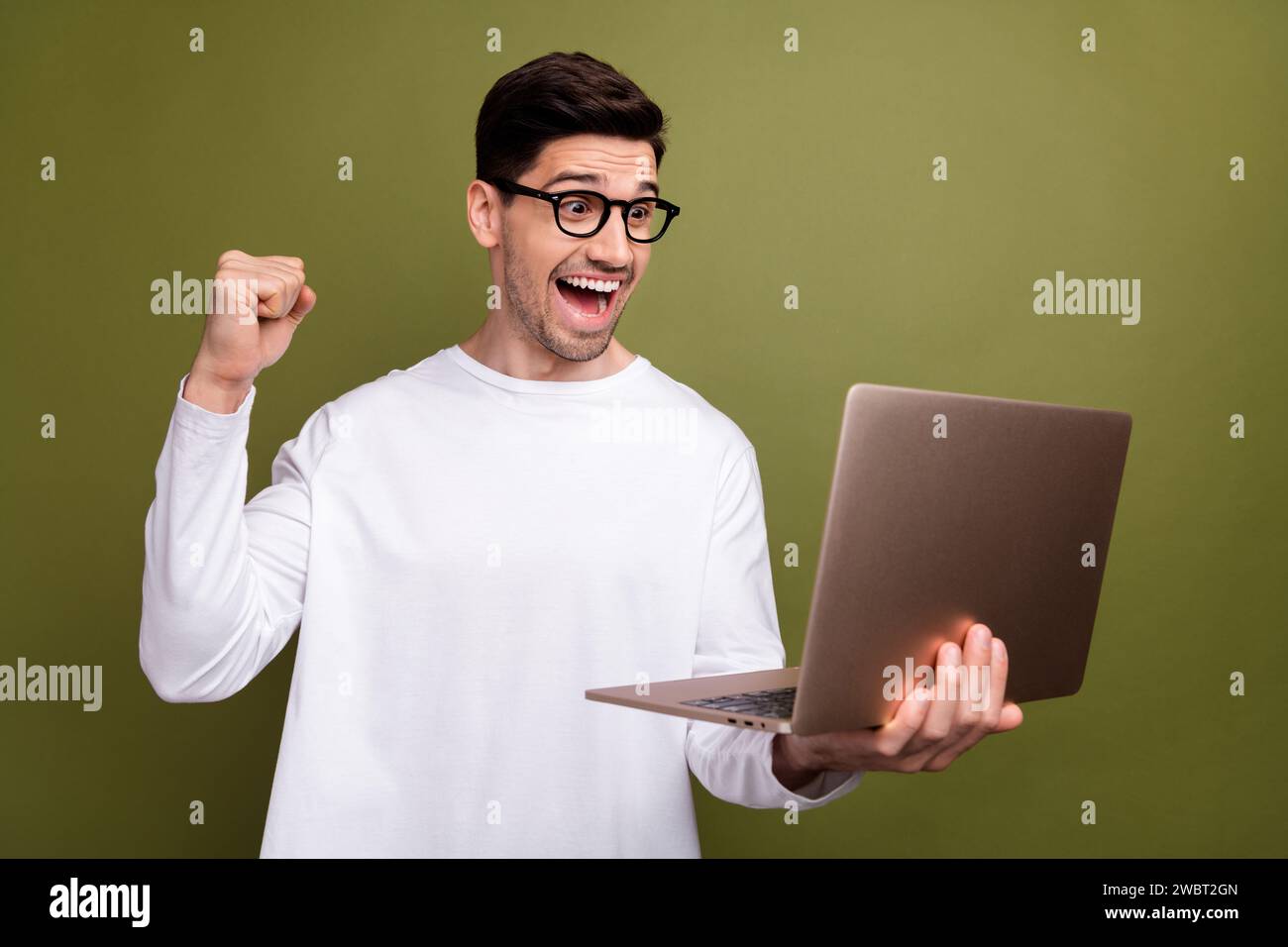 Photo of young successful businessman use laptop shock when realize his ...