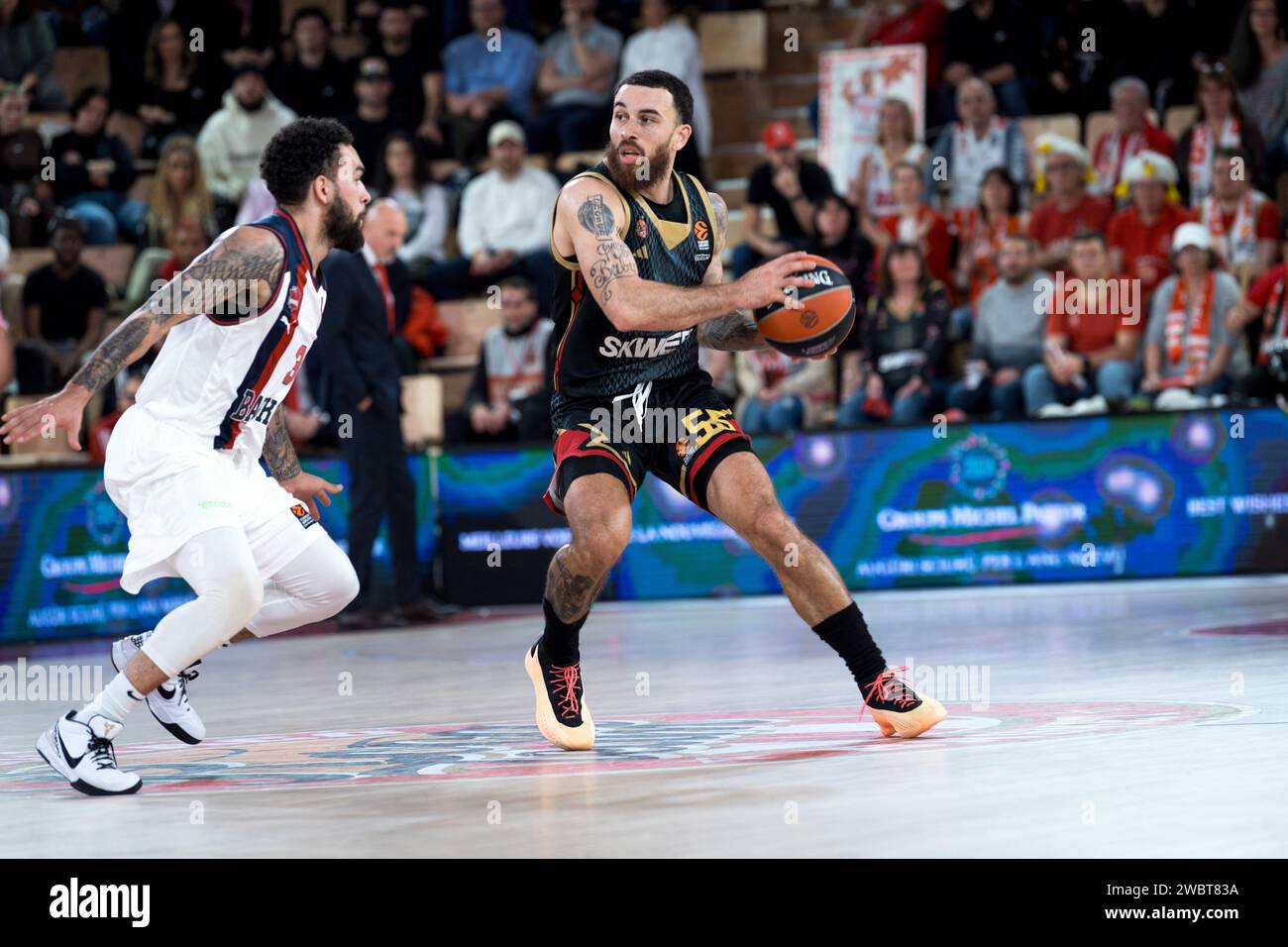 Monaco player #55 Mike James and Baskonia player #3 Chris Chiozza are ...
