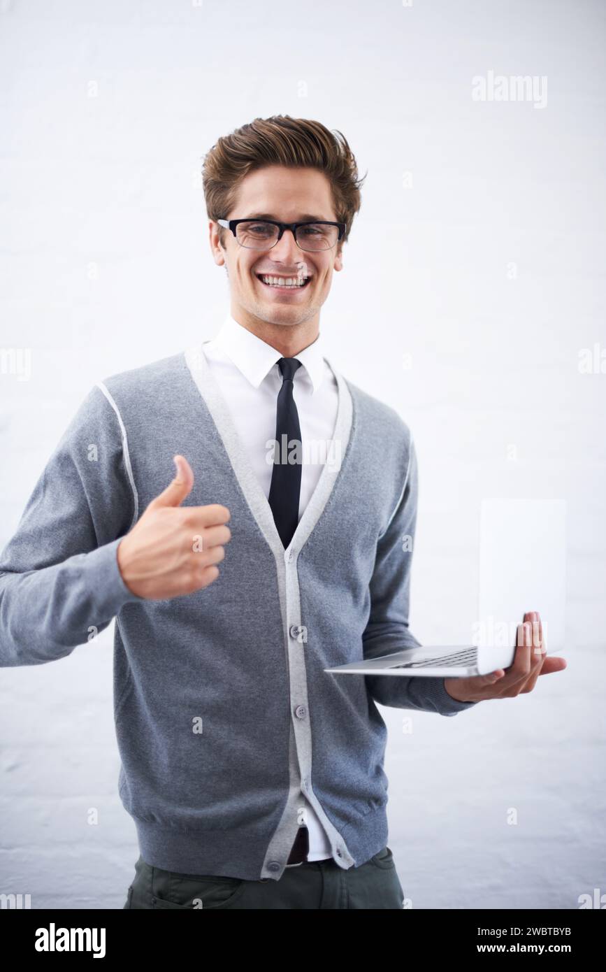 Happy man, portrait and laptop with thumbs up for winning or good job ...