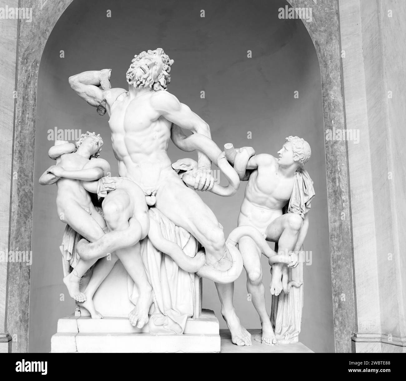 Marble statue, dating from around 40 BC, of the trojan priest Laocoon with sons and giant snakes; octagonal courtyard, Pio Clementino museum, Vatican. Stock Photo