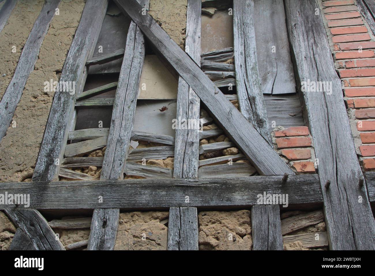 Detail of wattle and daub filling and bricks in a half-timbered house in Mesnil-Saint-Père in the Champagne-Ardennes region of France. Stock Photo