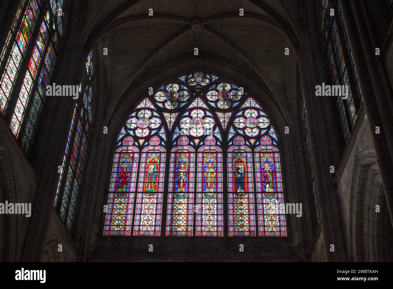 The stained-glass window over the main portal of St Urbain Basilica, Troyes, France, is a 1901 creation by Édouard Didron depicting saints and popes. Stock Photo