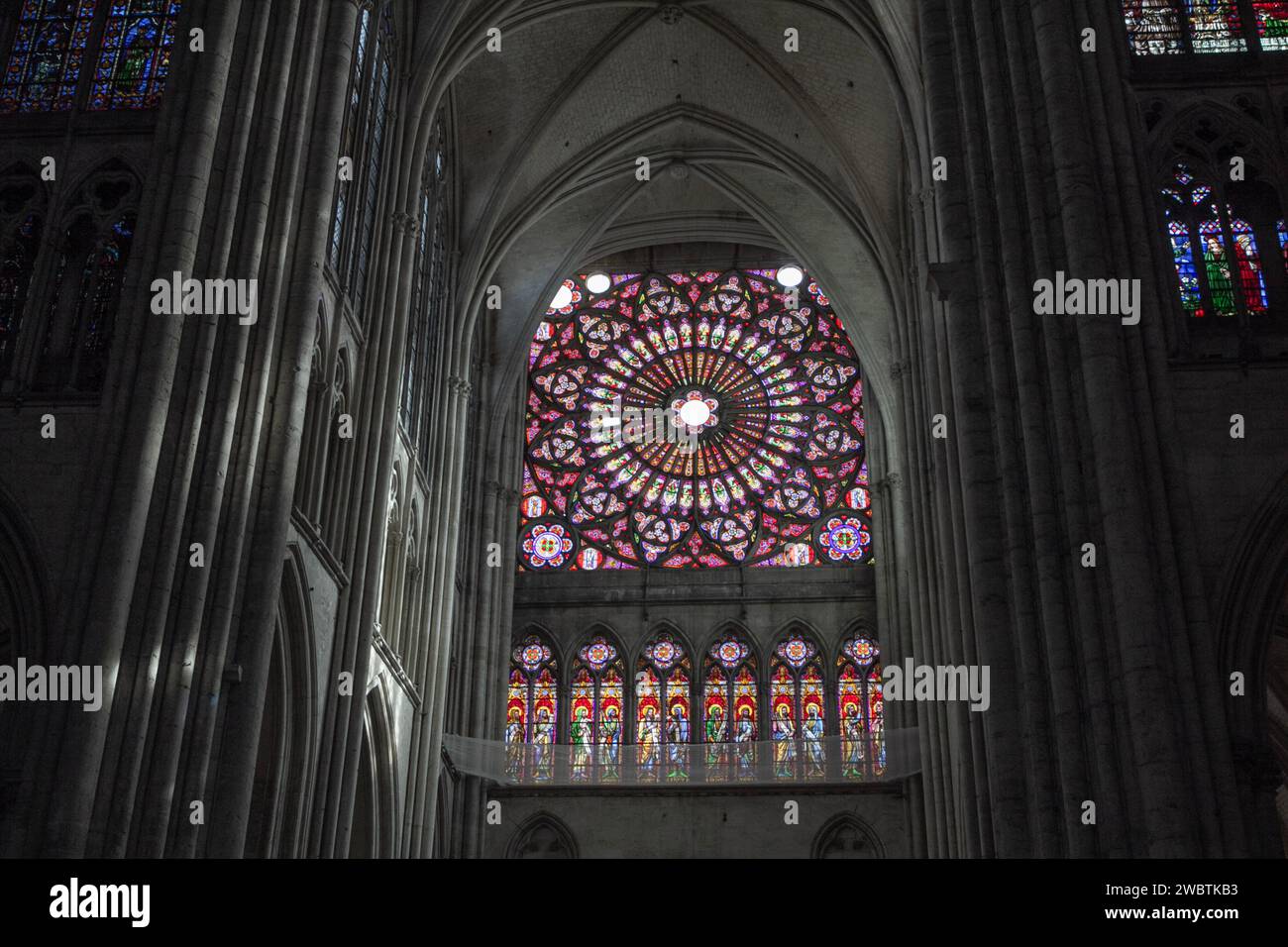 The rose window of the south transept of the Gothic St Peter and St Paul cathedral in Troyes, France. Stock Photo