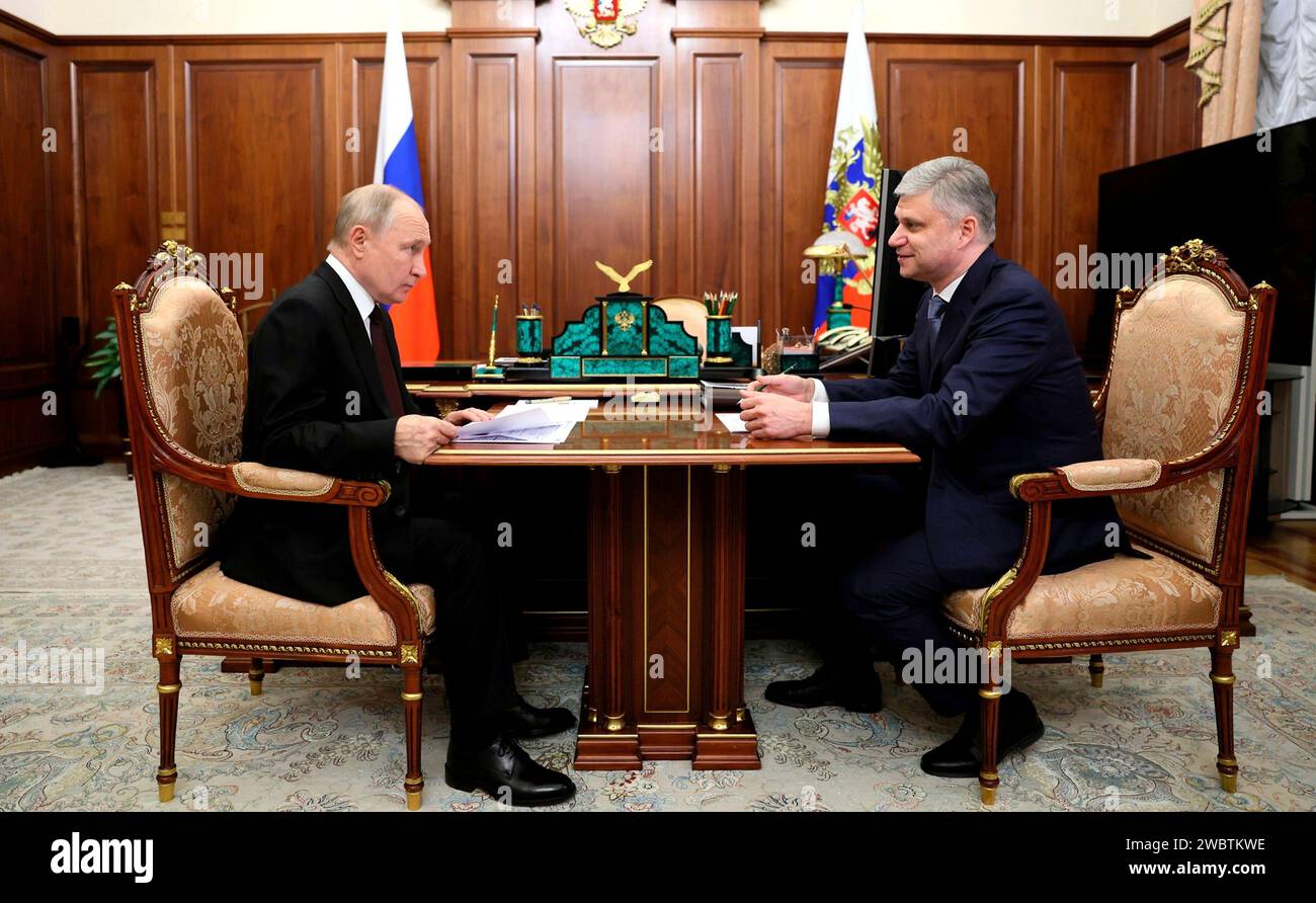 Moscow, Russia. 12th Jan, 2024. Russian President Vladimir Putin, left, listens to Russian Railways CEO Oleg Belozerov during a face-to-face meeting at the Kremlin, January 12, 2024 in Moscow, Russia. Credit: Gavriil Grigorov/Kremlin Pool/Alamy Live News Stock Photo