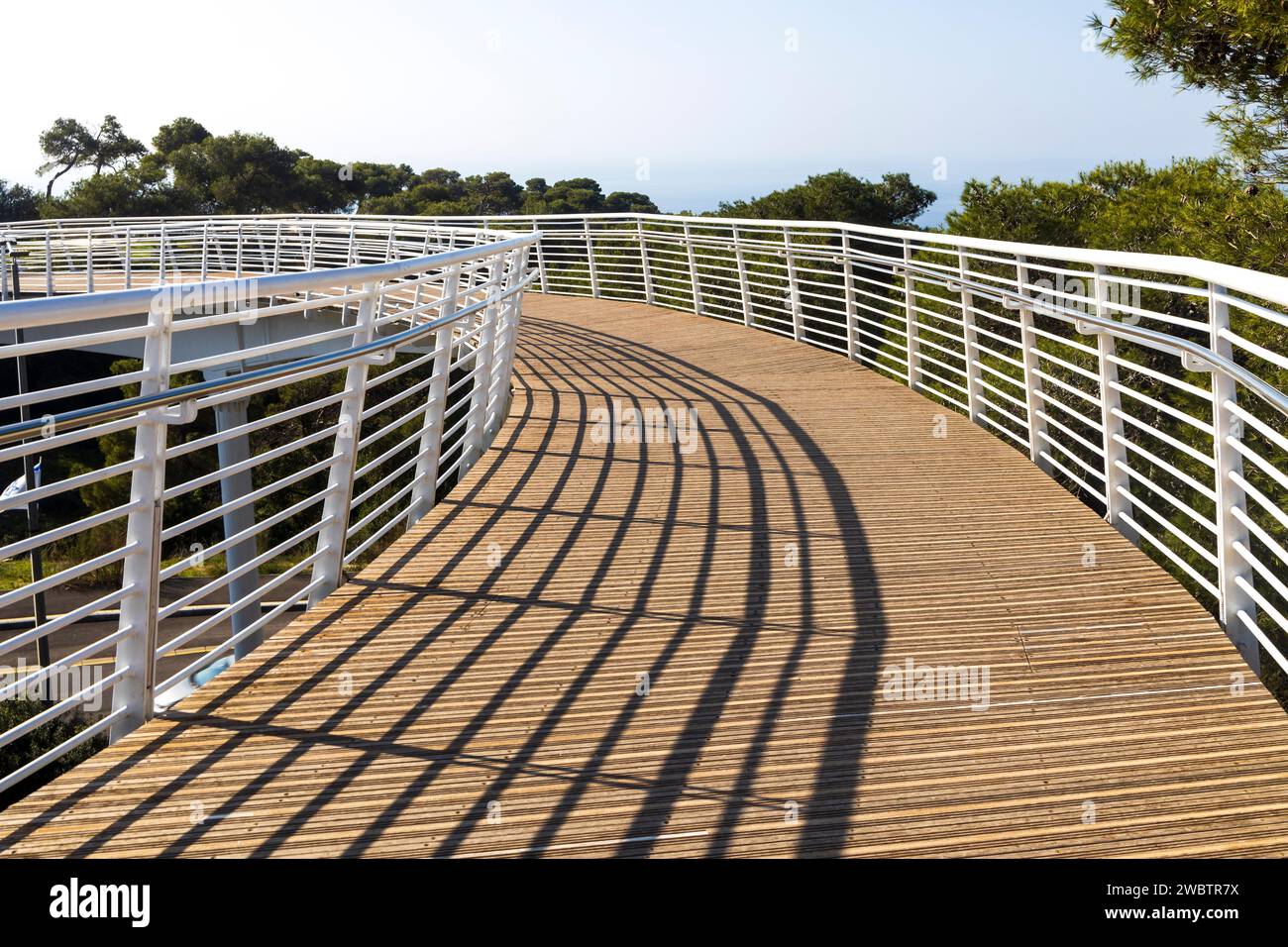 A modern pedestrian bridge over the highway from the Technion University to the nature reserve. Stock Photo