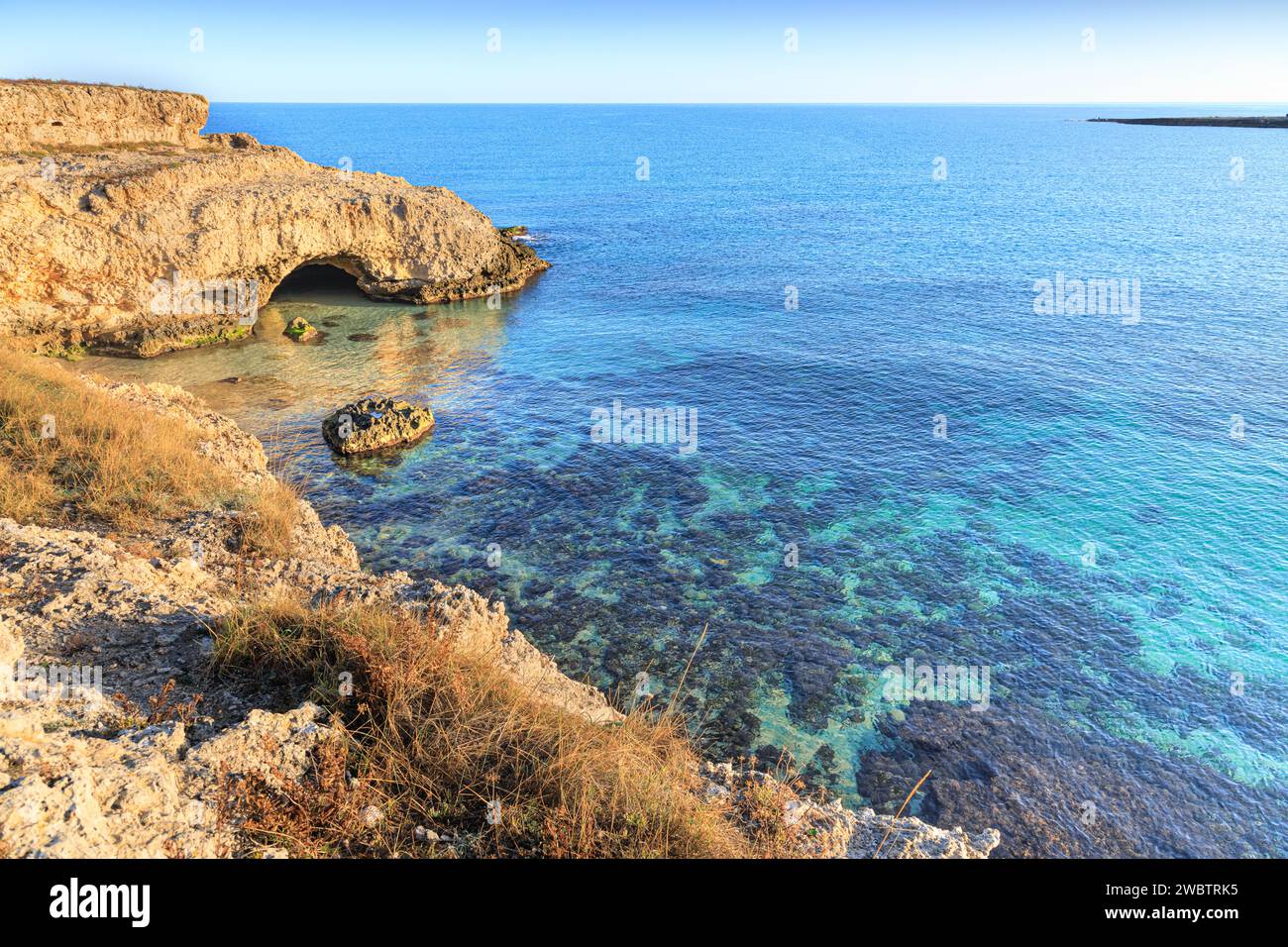 The most beautiful Apulian coast in Italy: Cala Corvino. Typical coastline near Monopoli : high and rocky coast characterized by small sandy coves wit Stock Photo