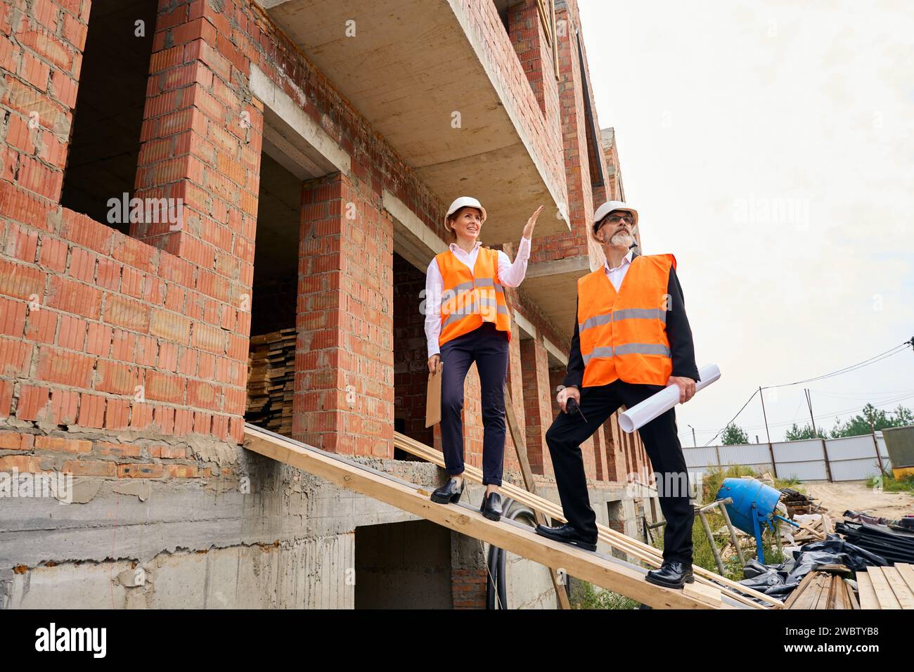 Building Inspector Professional Development Building inspector and foreman inspecting development site Stock Photo ...