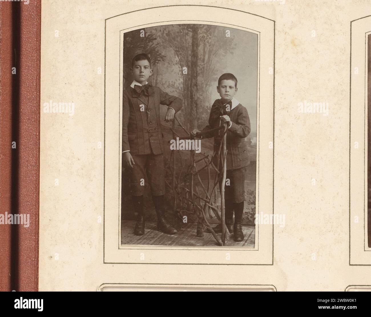 Portrait of two boys at a fence of branches, Jan van Roon, 1903 - 1948 ...