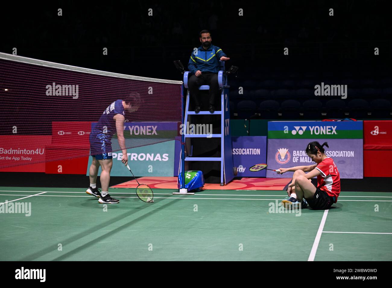Kuala Lumpur, Malaysia. 12th Jan, 2024. Zhang Yiman (R) of China reacts ...