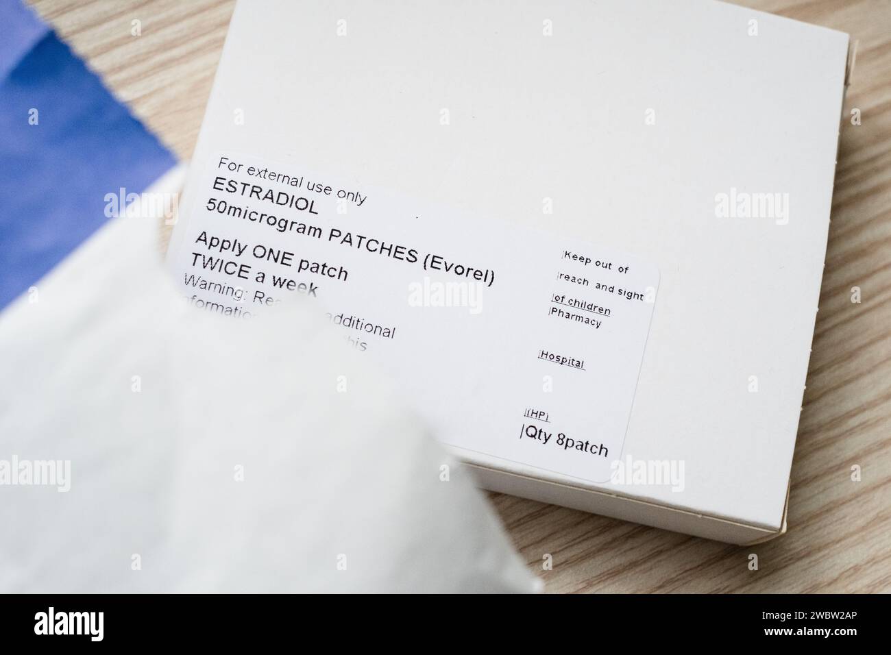 Hormone Replacement Therapy medication coming out of a paper pharmacy bag. Stock Photo