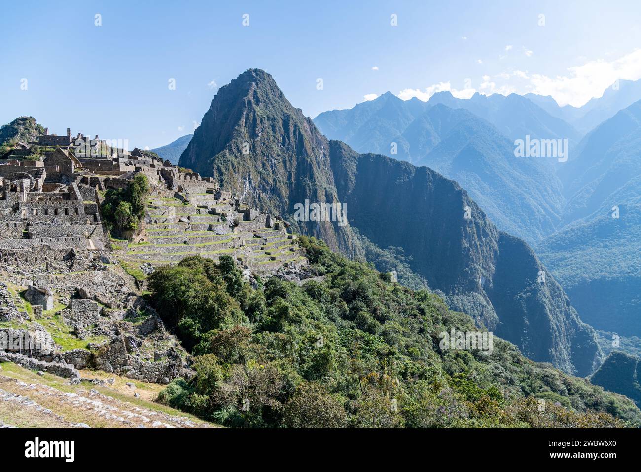 A view of the Machu Picchu citadel ruins and Huayna Picchu mountain in the Sacred Valley in Peru Stock Photo