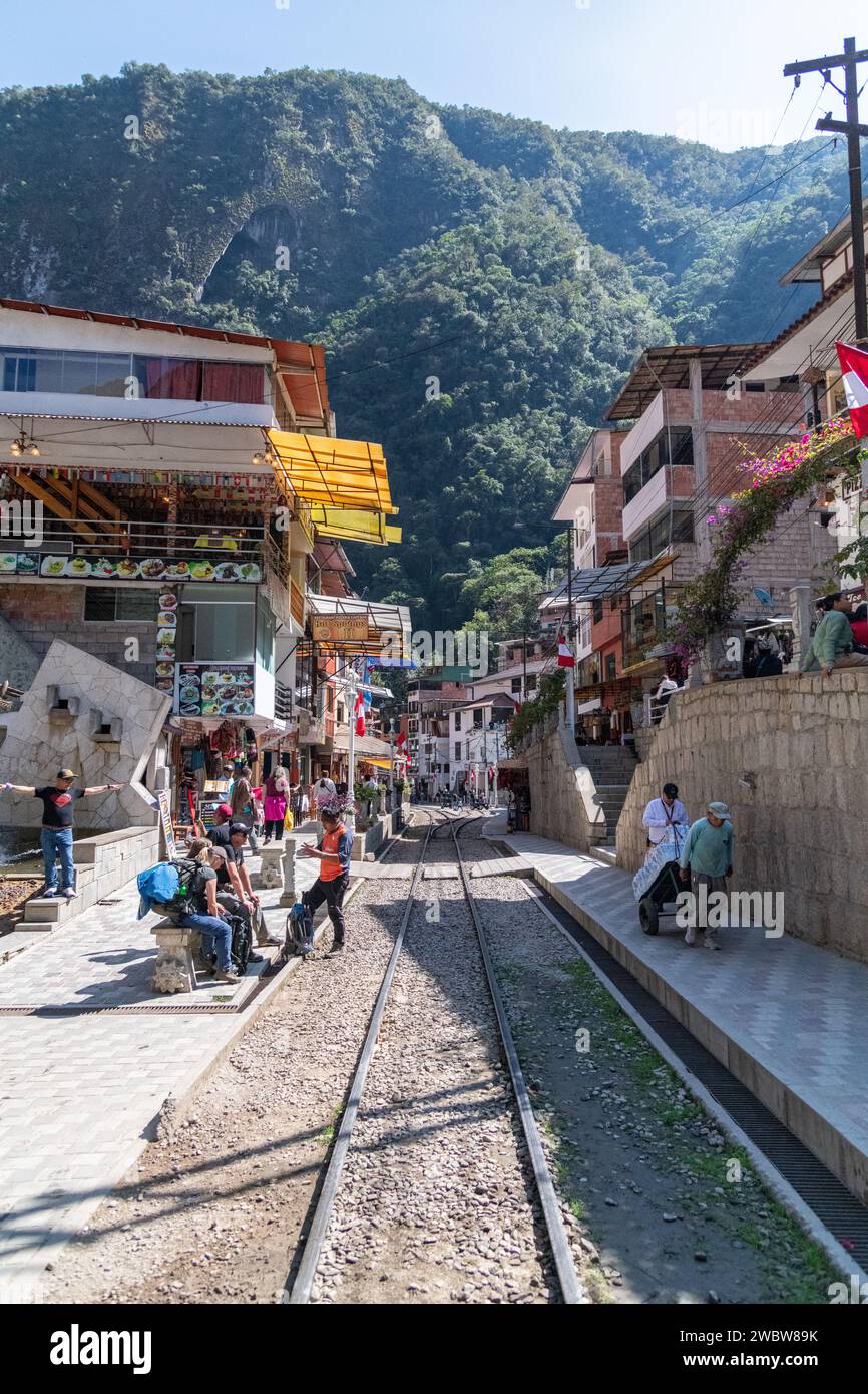 The railway track going through the town of Aguas Calientes near Machu Picchu in Peru Stock Photo