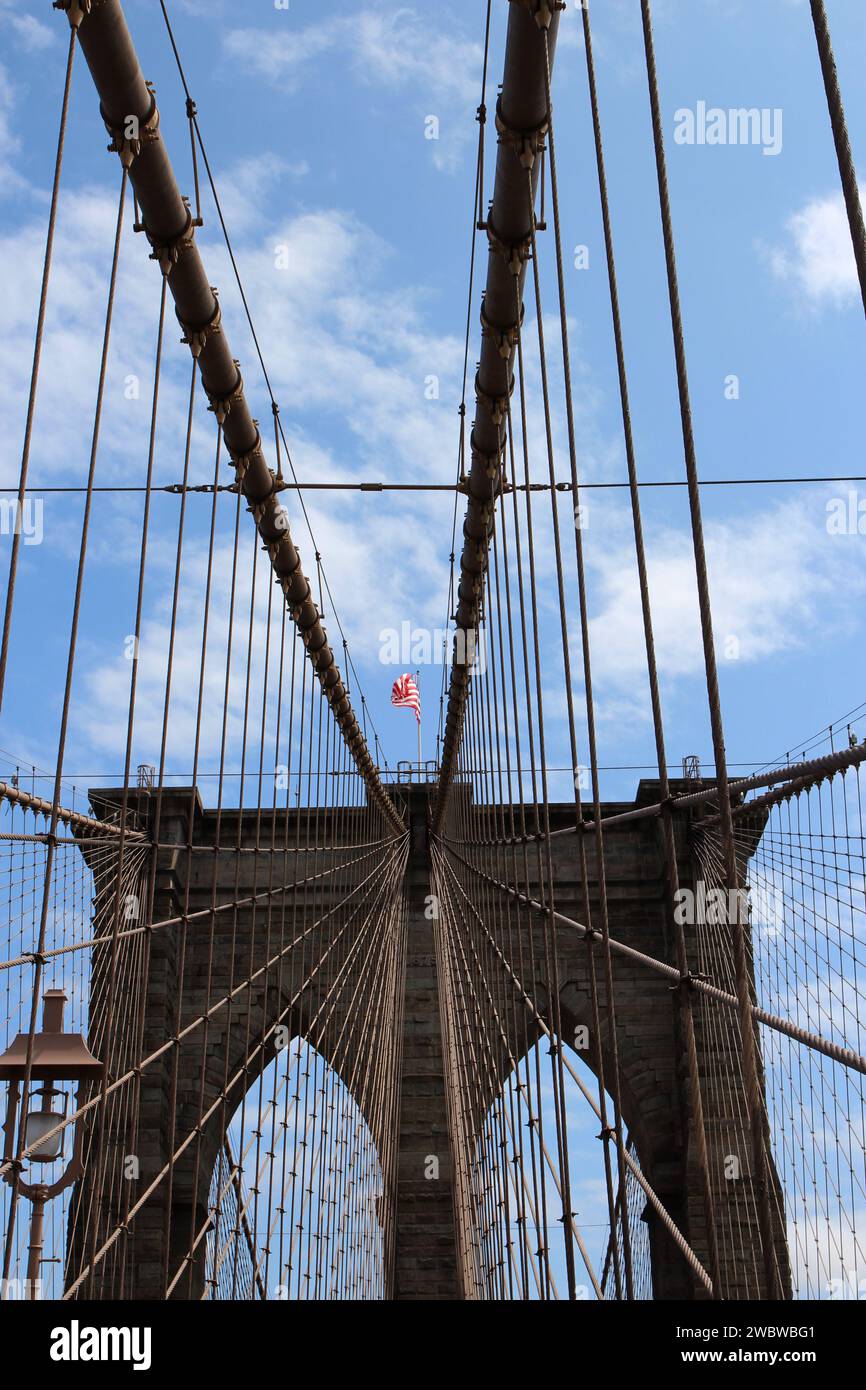 Looking up the Main Cables and suspender cables attaching to a tower on the Brooklyn Bridge in Manhattan, New York, USA Stock Photo