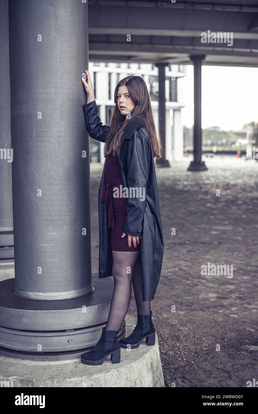 selbstbewusste junge Frau mit schwarzem Mantel *** Self-confident young woman with a black coat Stock Photo