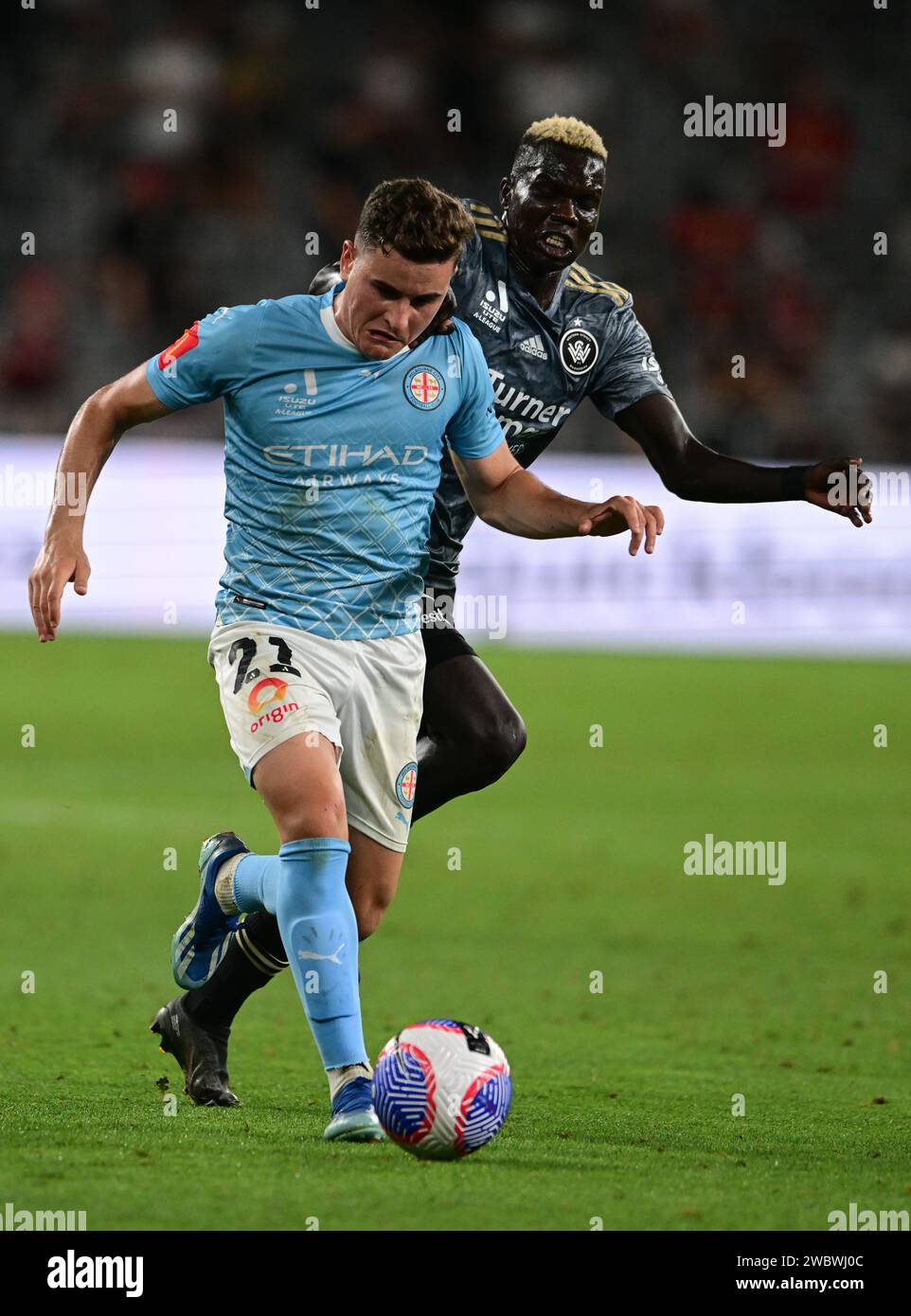 Parramatta, Australia. 12th Jan, 2024. Alessandro Lopane (L) of the Melbourne City FC and Valentino Kuach Yuel (R) of the Western Sydney Wanderers FC seen in action during the A-League Men's 2023/24 season Unite Round match between Melbourne City FC and Western Sydney Wanderers FC at CommBank Stadium. Final score; Western Sydney Wanderers 1:0 Melbourne City FC. (Photo by Luis Veniegra/SOPA Images/Sipa USA) Credit: Sipa USA/Alamy Live News Stock Photo