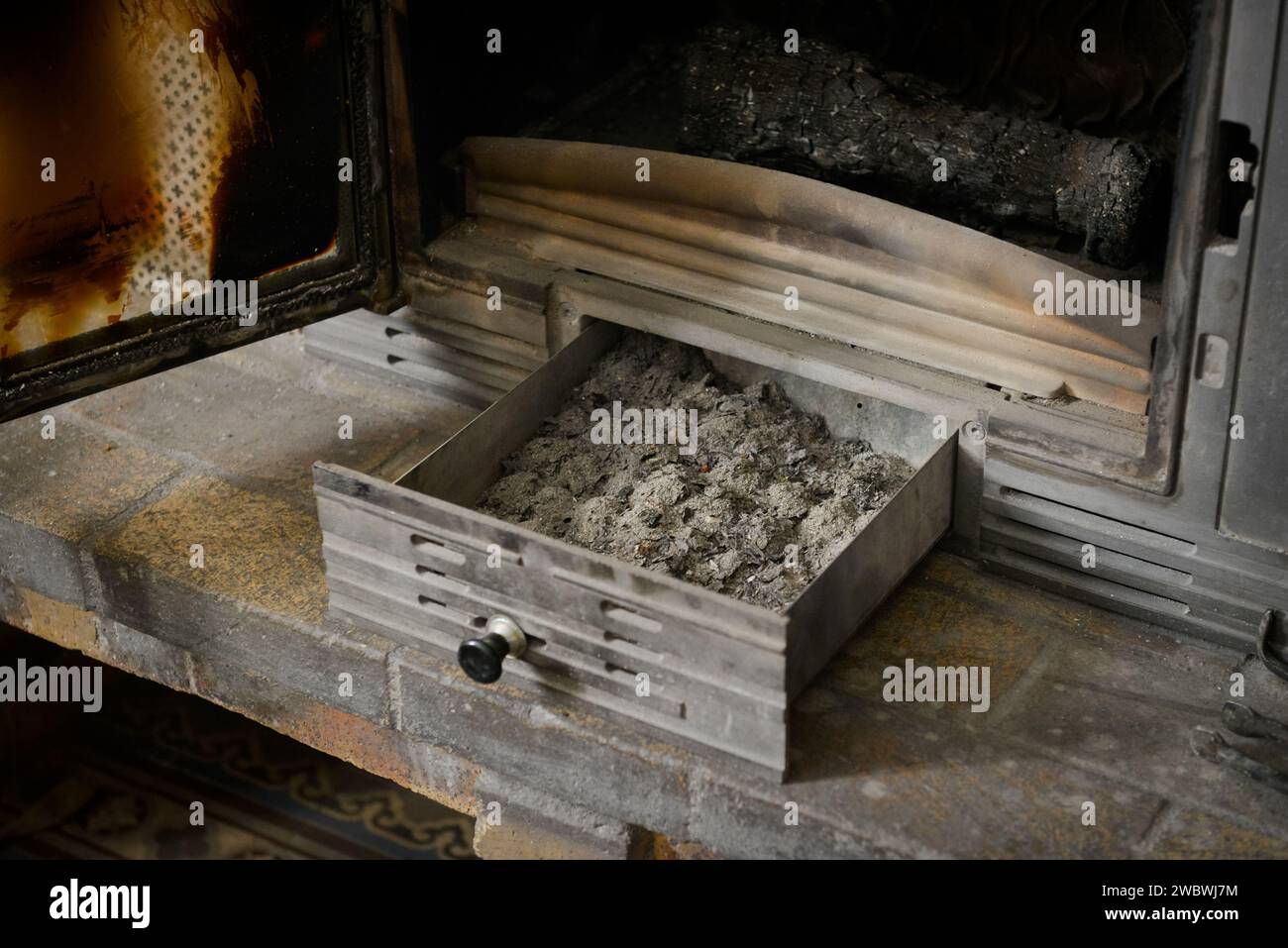 Firewood ash from a fire that fell into a chimney pan Stock Photo