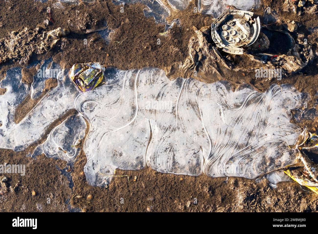 Patterns in frozen ice on a puddle, UK Stock Photo