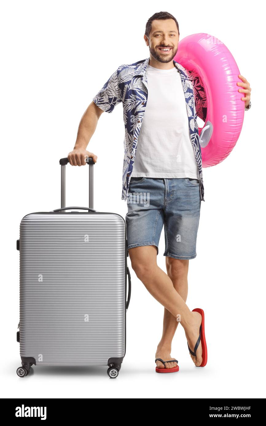 Man with a suitcase smiling and holding a swimming ring isolated on white background Stock Photo