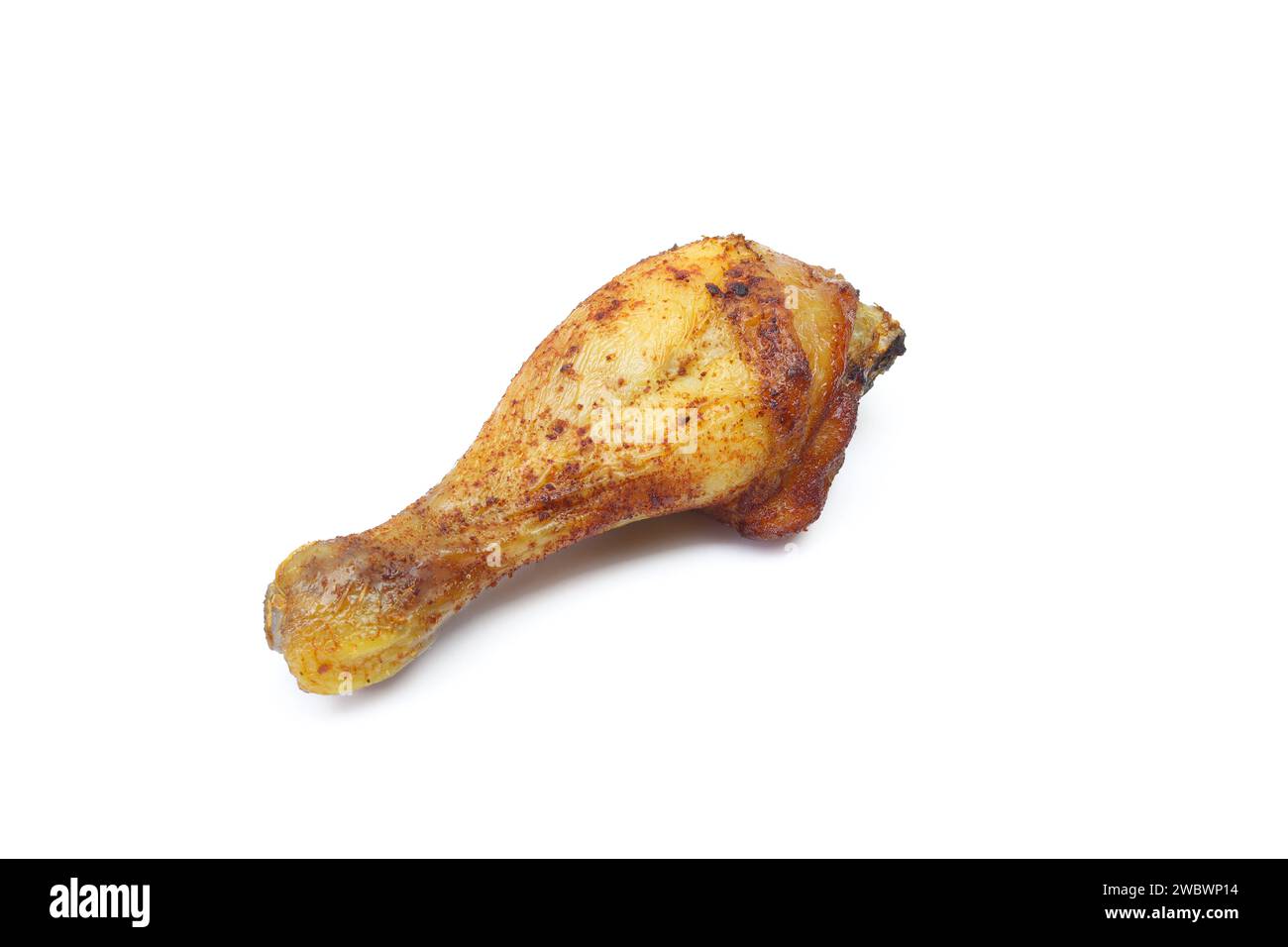 Roasted and marinated chicken drumstick thigh leg isolated on white