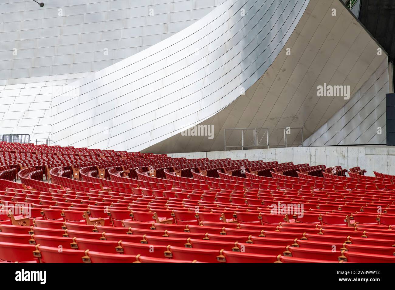 Chicago, IL, USA-September 27, 2023; Curved rows of red plastic seats in empty Jay Pritzker Pavilion designed by architect Frank Gehry Stock Photo