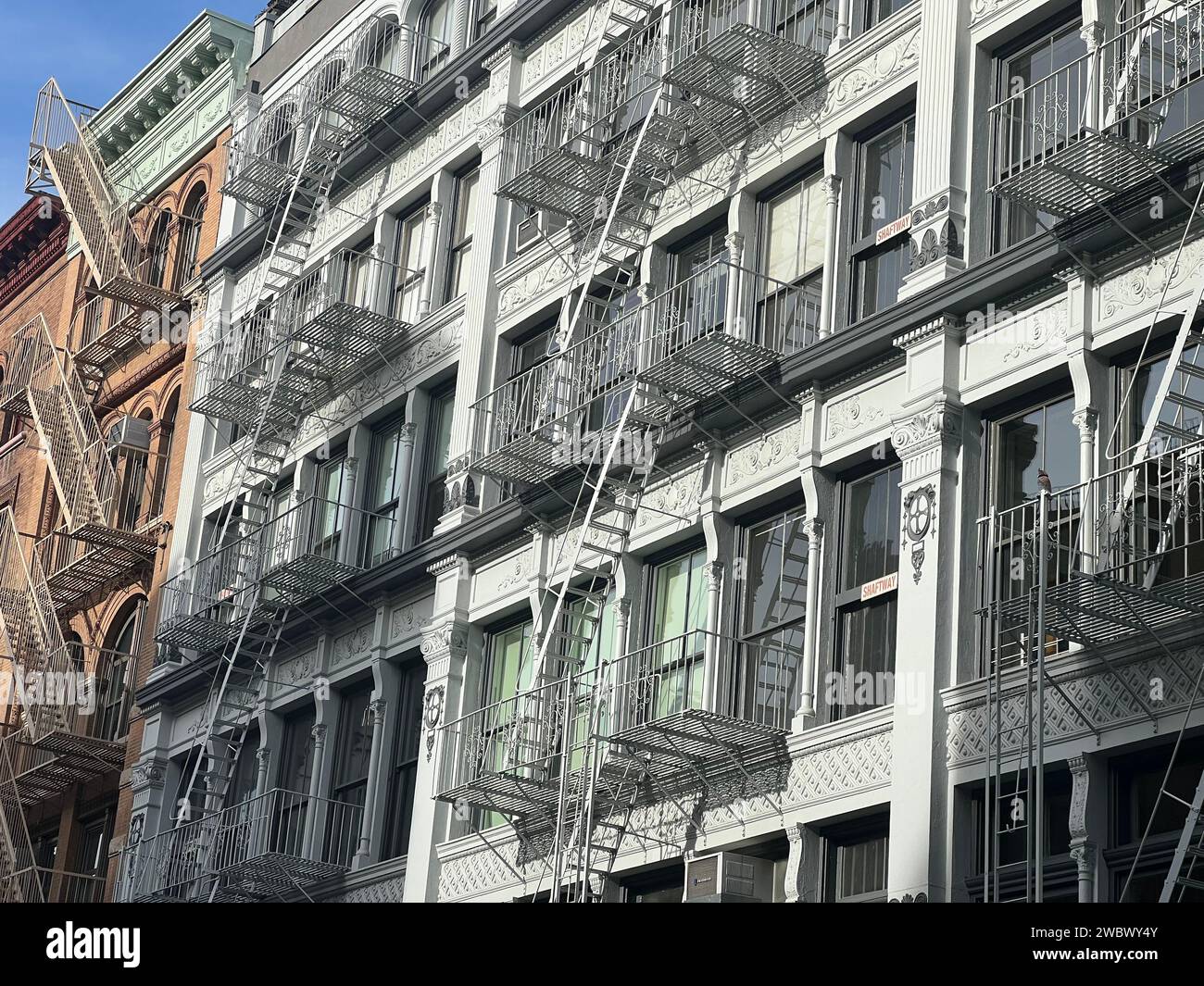 Old colorful buildings with fire ladder on New-york manhattan, Upper East Side, facade buildings Stock Photo