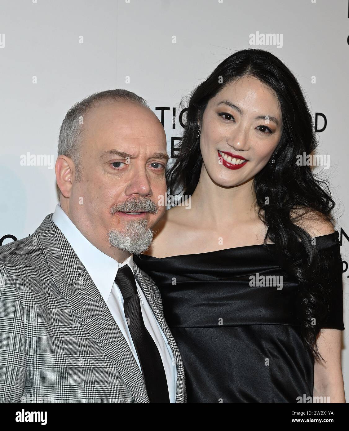 New York, USA. 12th Jan, 2024. Paul Giamatti and Clara Wong attend the