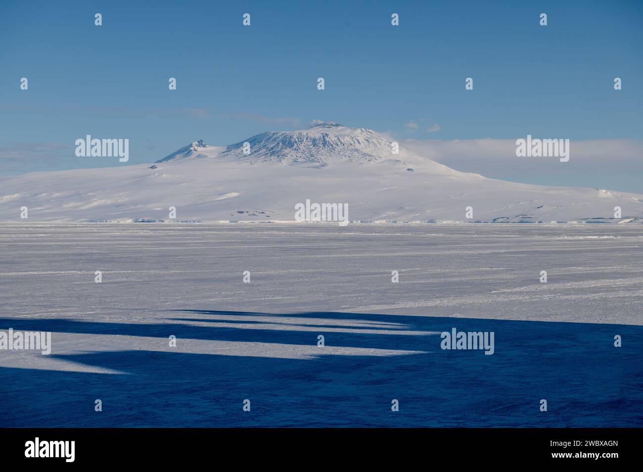 McMurdo Station, Antarctica. 28 December, 2023. Mt. Erebus, the tallest active volcano in Antarctica and the southernmost active volcano in the world, is seen from the deck of the Coast Guard Cutter Polar Star near the U.S. Antarctic research station, December 28, 2023 in McMurdo Sound, Antarctica.  Credit: PO3 Ryan Graves/U.S. Coast Guard/Alamy Live News Stock Photo