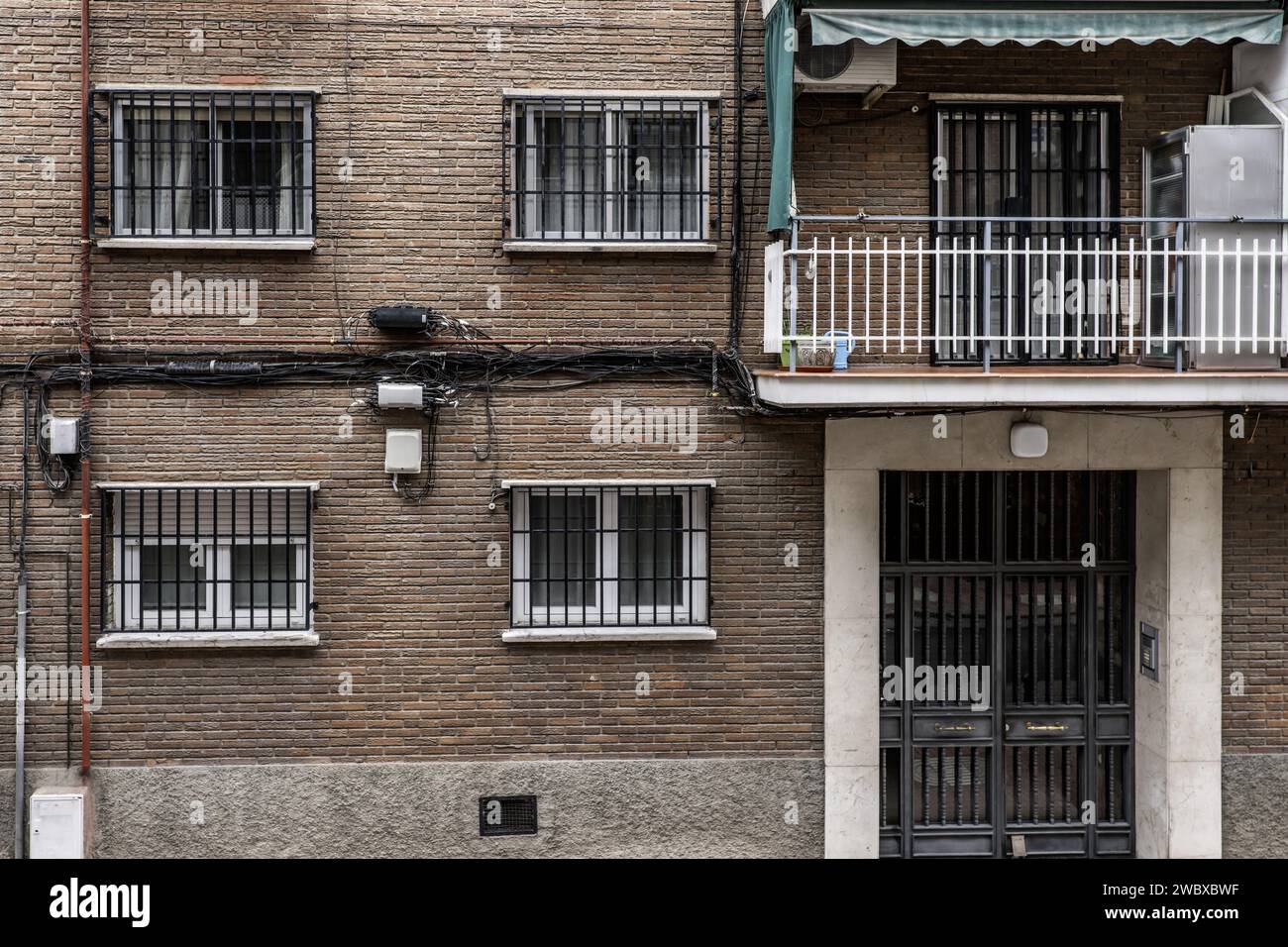 Facade of a conventional urban residential housing building with anti