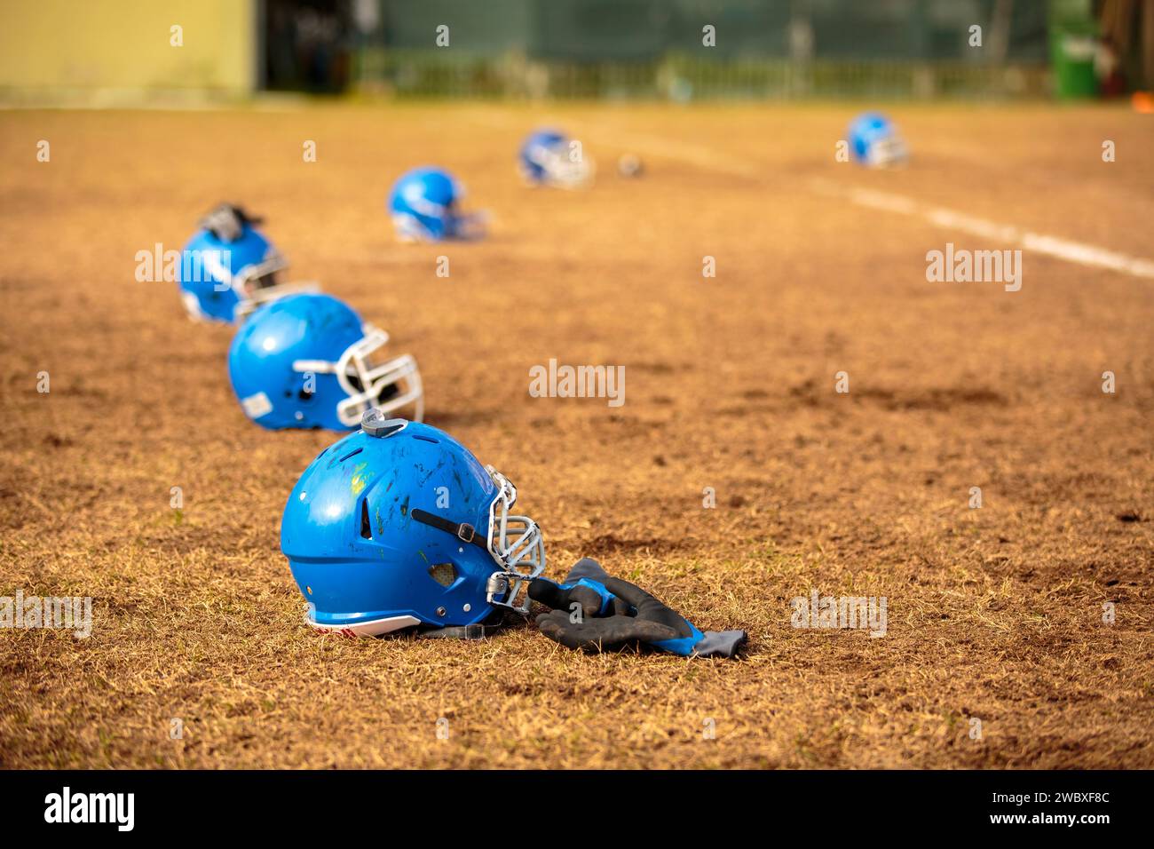American football team helmets on the pitch. Soccer helmet Stock Photo