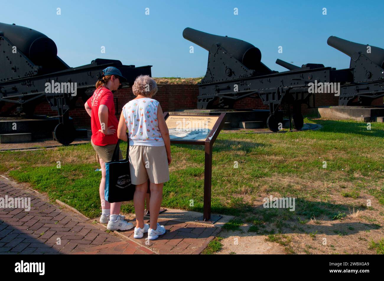 Guns on Outer Battery with interpretive board, Fort McHenry National Monument and Historic Shrine, Maryland Stock Photo